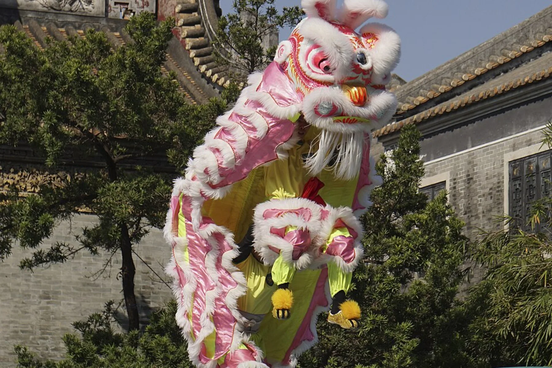 Pink-and-white lion-dance performance at Foshan Ancestral Temple