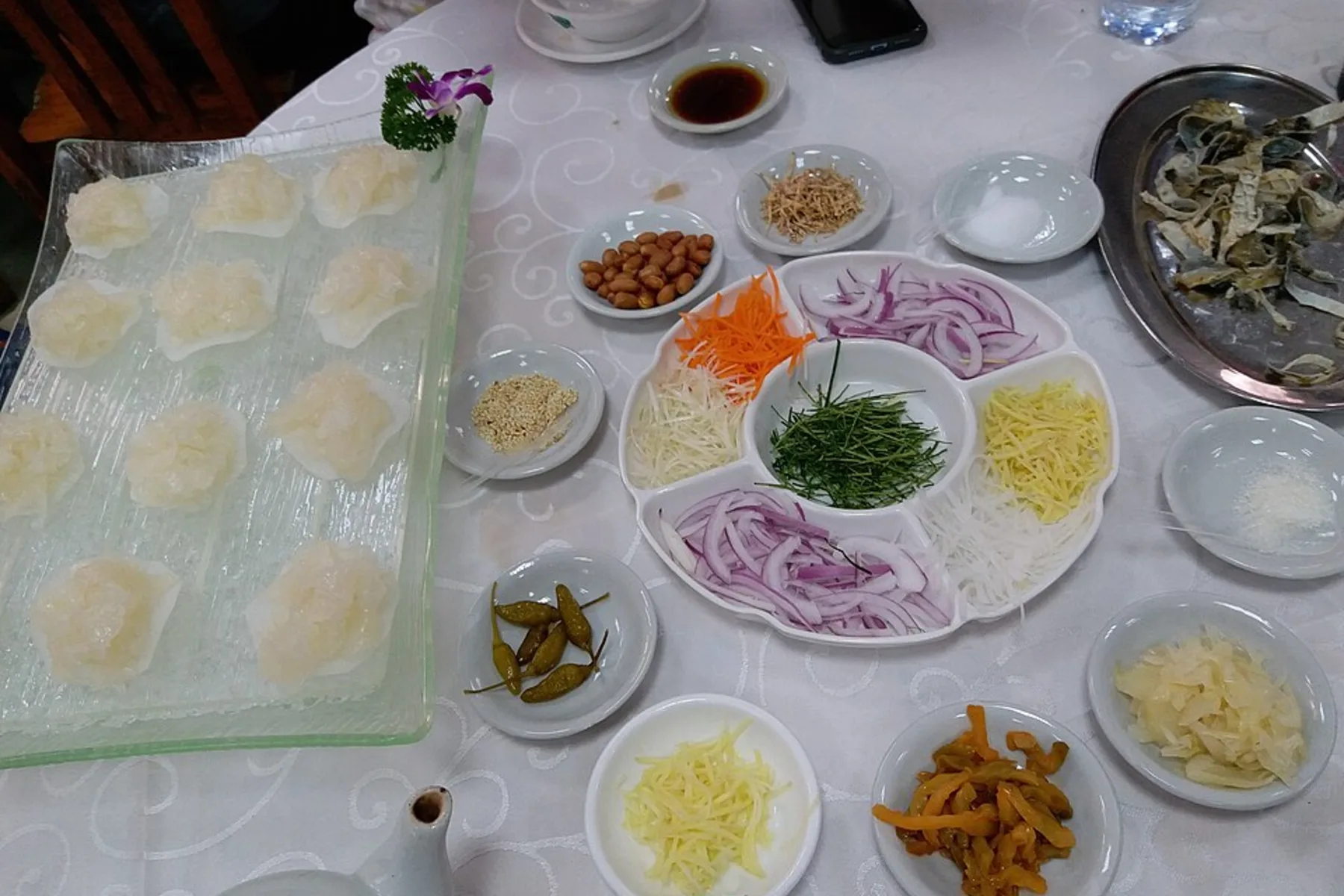 Yusheng ingredients arranged on a table in Shunde