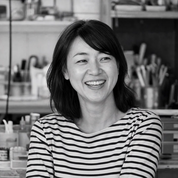 Black-and-white editorial portrait of Ana Ribeiro, a fictional Foshan Living author persona