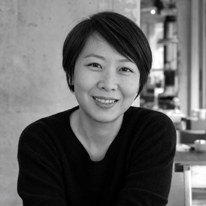 Black-and-white editorial portrait of Mei-lin Cheung, a fictional Foshan Living author persona