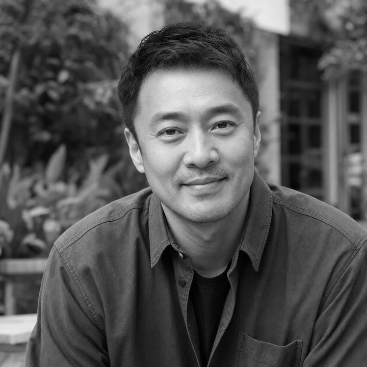 Black-and-white editorial portrait of Zhang Wei, a fictional Foshan Living author persona